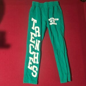 Fuzzy green “Constructed In The Trenches” sweatpants